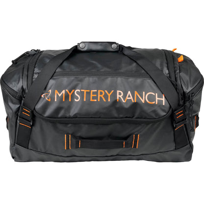 Black duffel bag with orange text 'Mystery Ranch' on a white background