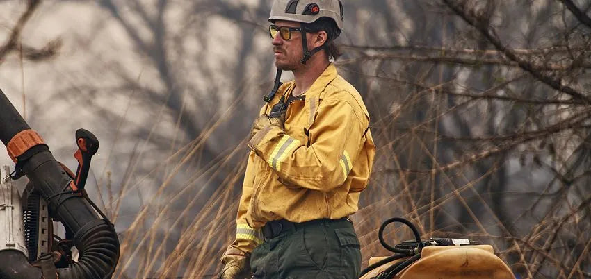 wildland firefighter in yellow and green Propper wildland gear